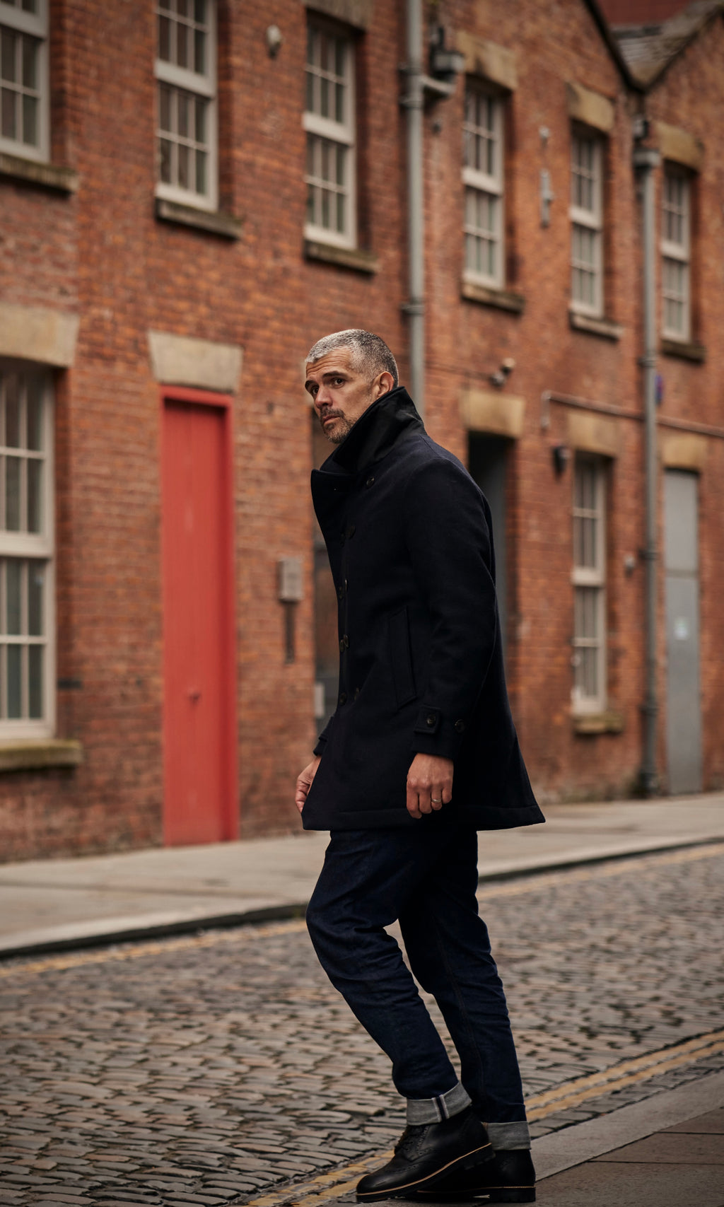 Man in FRAHM Peacoat on street in Manchester