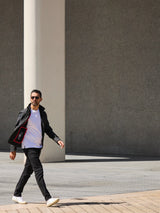 Model wearing FRAHM Harrington Racer Jacket 2026 Black outdoors full body