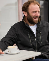 Model wearing FRAHM Quilted Harrington Racer Jacket 2026 in Black