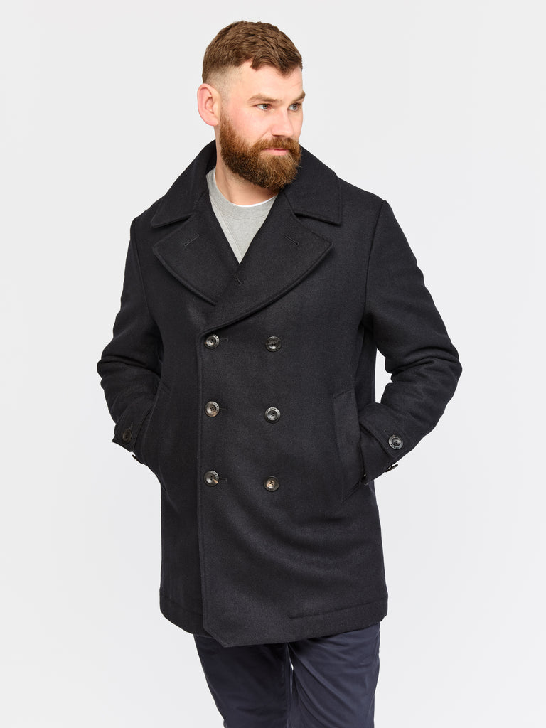 Model wearing FRAHM Pure Wool Peacoat 2026 Midnight Blue in studio