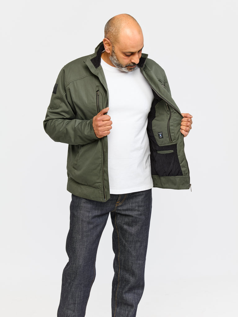 Model wearing FRAHM Quilted Harrington Jacket 2026 Sage Green in studio