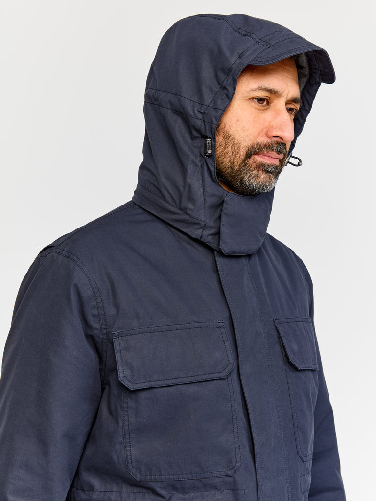 Model wearing FRAHM Ventile Thermal Field 2026 Classic Navy showing hood details