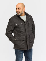 Front view of model wearing FRAHM Waxed Classic Field Jacket 2026 Black in studio