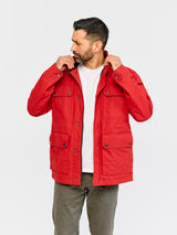 Model wearing FRAHM Waxed Quilted Field Jacket 2026 Classic Red in studio