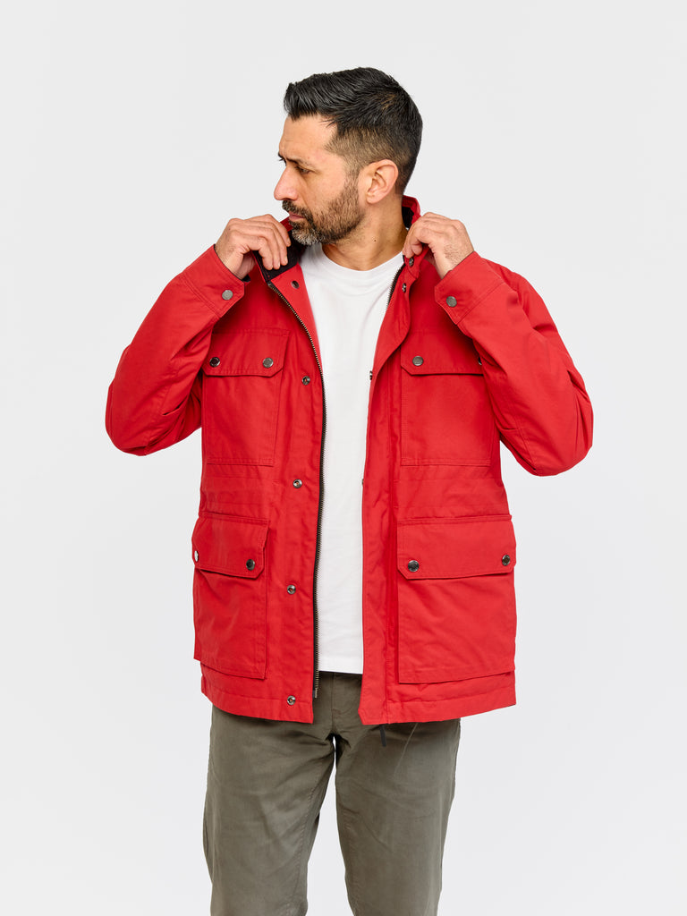 Model wearing FRAHM Waxed Quilted Field Jacket 2026 Classic Red in studio
