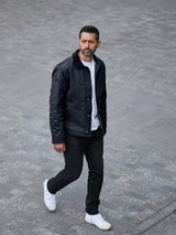 Model wearing FRAHM Heavy Twill Deck Jacket Midnight Blue outdoors full body
