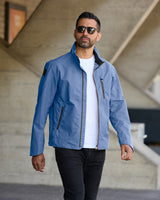 Model wearing FRAHM Harrington Racer Jacket 2027 in Sky Blue outdoors front view