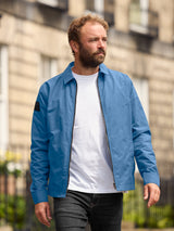 Model wearing FRAHM Lightweight Blouson Jacket 2027 Sky Blue front view outdoors