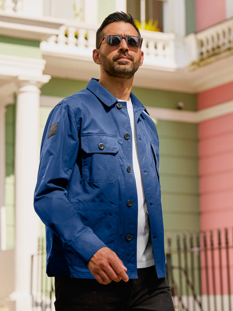 Model wearing FRAHM Original Lightweight Workers Jacket 2027 in French Blue outdoors