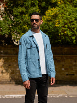 Model wearing FRAHM Waxed Lightweight Workers Jacket 2027 Turquoise outdoors