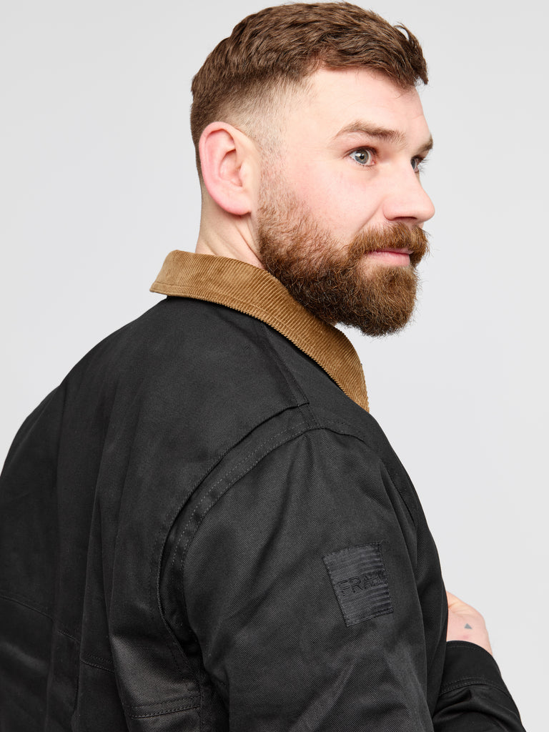 Model wearing FRAHM Heavy Twill Deck Jacket Black showing collar and fabric detail