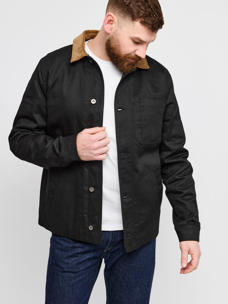 Model wearing FRAHM Heavy Twill Deck Jacket in Black indoor front view