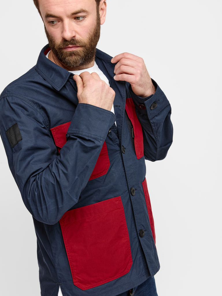 Close up of model wearing FRAHM Waxed Lightweight Workers Jacket 2027 Dark Navy with Red