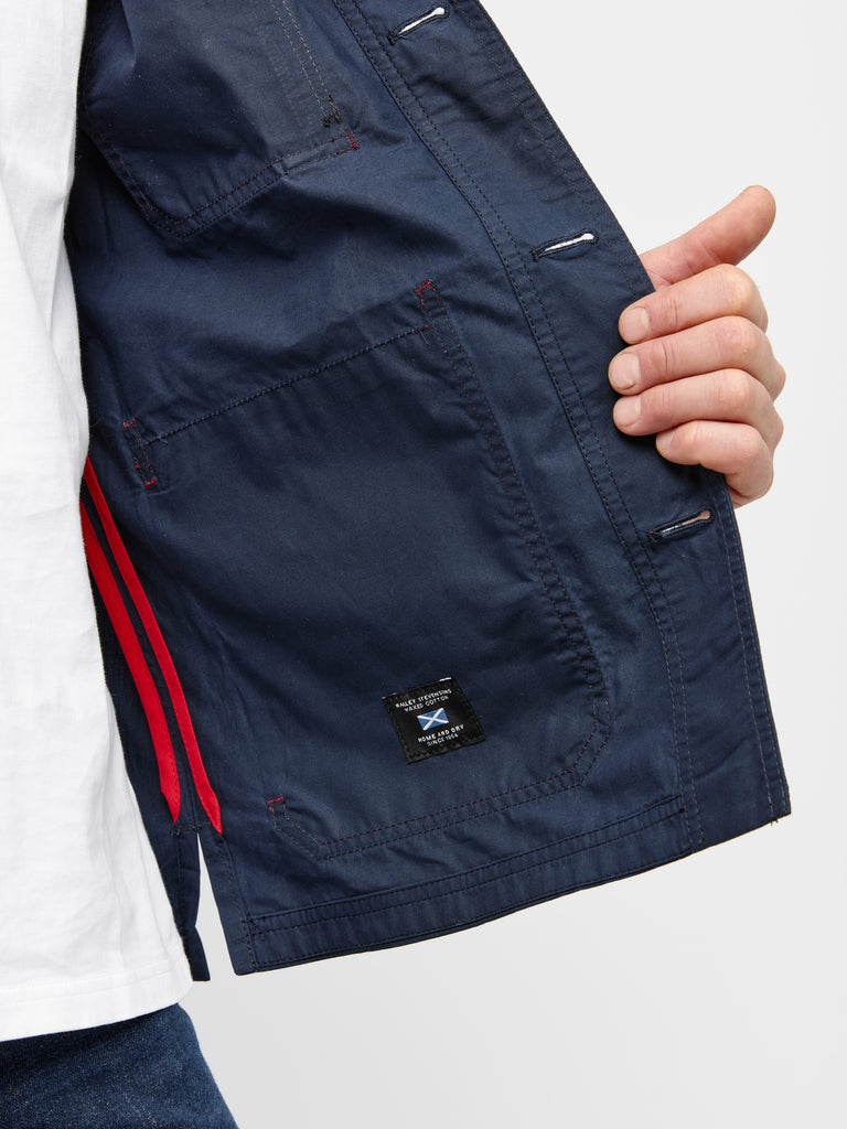 Close up of inner fabric of FRAHM Waxed Lightweight Workers Jacket 2027 Dark Navy with Red