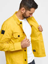 Model wearing FRAHM Waxed Lightweight Workers Jacket 2027 Sunshine Yellow showing inner fabric