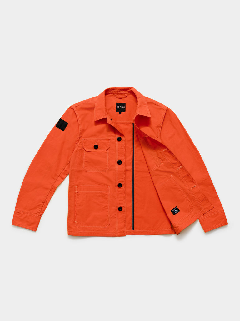 Flat lay of FRAHM Waxed Lightweight Workers Jacket 2026 Blaze Orange showing inner fabric detail